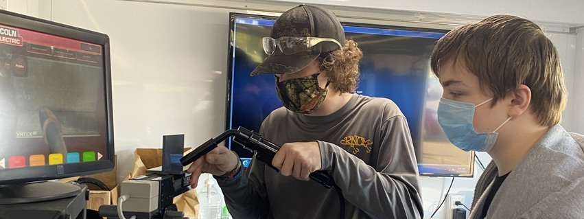 Student welding on virtual welder